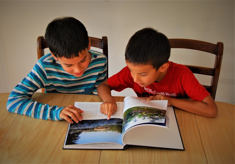 Do you remember? That's where Daddy fell in the river. Kids love being hands-on with their blog book.